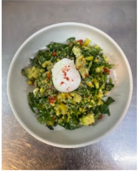 A colourful fresh bowl with greens and poached egg